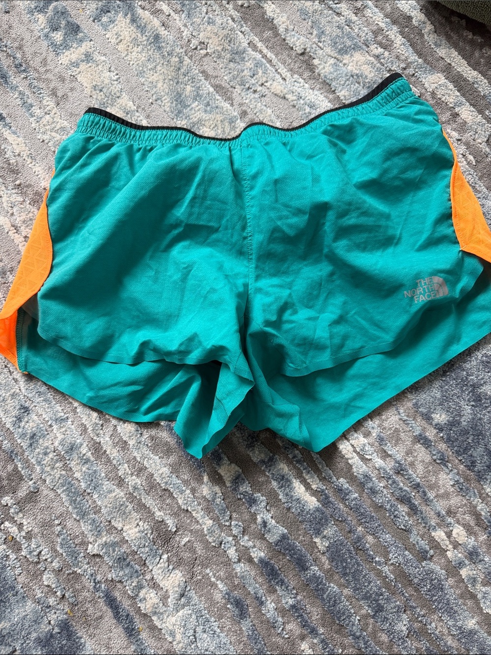 The North Face Teal Running Shorts with Orange Side Panels